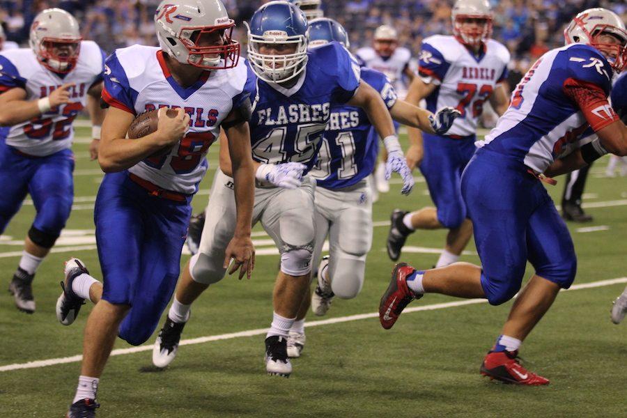 REBELS OUTPLAY FC: Senior Kenny Gillum charges through the defending Franklin Central Flashes at Lucas Oil. Gillum is the leading rusher for Roncalli this season with a total of 240 yards in the first three games. 