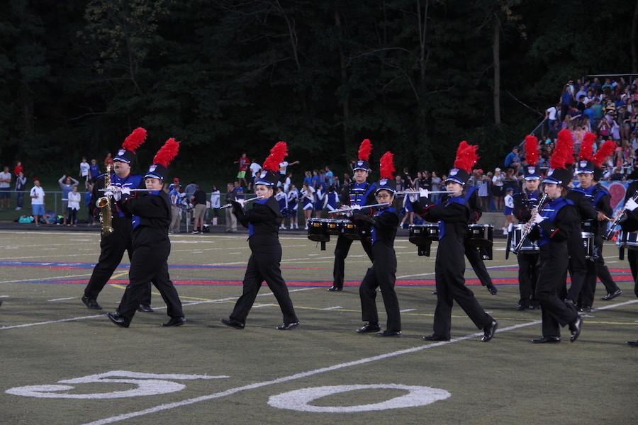 MARCH TO THE BEAT: The Rebel Marching Band performing at the Roncalli v.s. Bishop Chatard game. The band performs weekly at halftimes of football games.