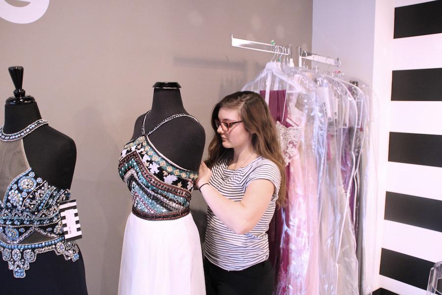PROM EXPERTISE: Senior Ally Pence works at Sophia's Bridal Tux & Prom. Pence has spent a good amount of time with eager customers, making her an expert in fashion expertise for the upcoming prom season.