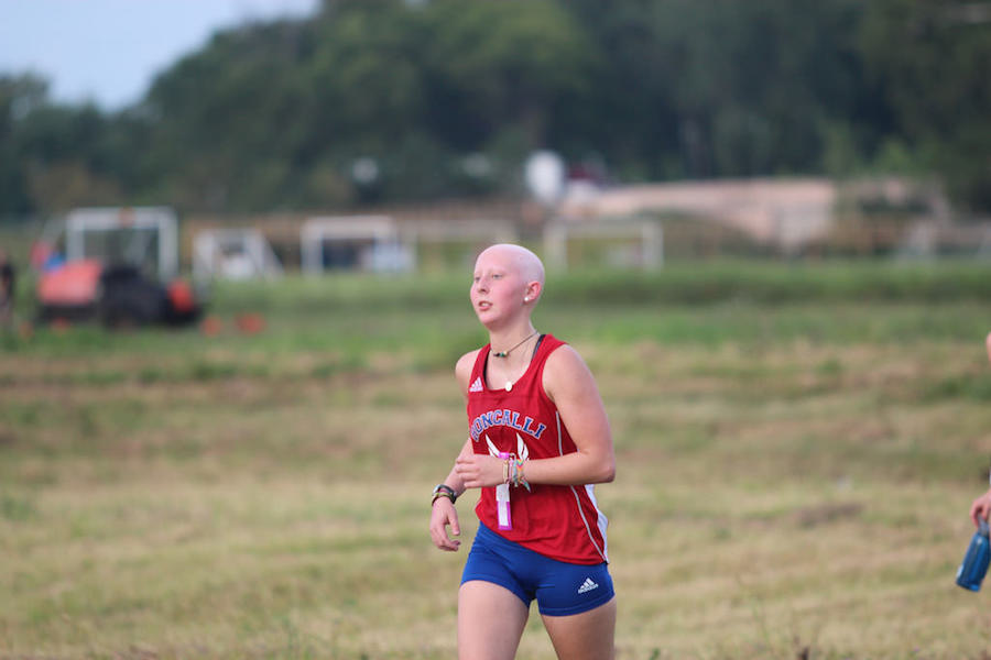 COURAGEOUS%3A+Senior+Kathleen+Soller+runs+toward+the+finish+line+at+the+Triton+Central+Invitational+meet+that+kicked+off+the+season.+Soller+still+attends+practices+and+meets+despite+ongoing+chemo+treatments.