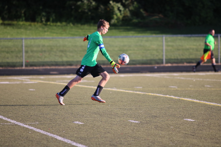 SEEING+GREEN%3A+Junior+Daniel+Woodruff+dropkicks+the+ball+after+stopping+a+goal+at+the+Southport+match+last+Thursday.+This+year+will+mark+Woodruff%E2%80%99s+third+year+as+a+varsity+goalkeeper.