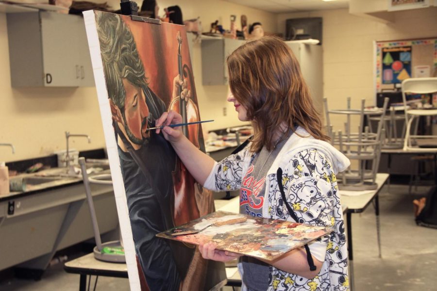 PICTURE THIS: Pictured above is one of senior Rachel Knierman’s most recent paintings portraying a violinist. This painting is to be used in an upcoming violin competition.