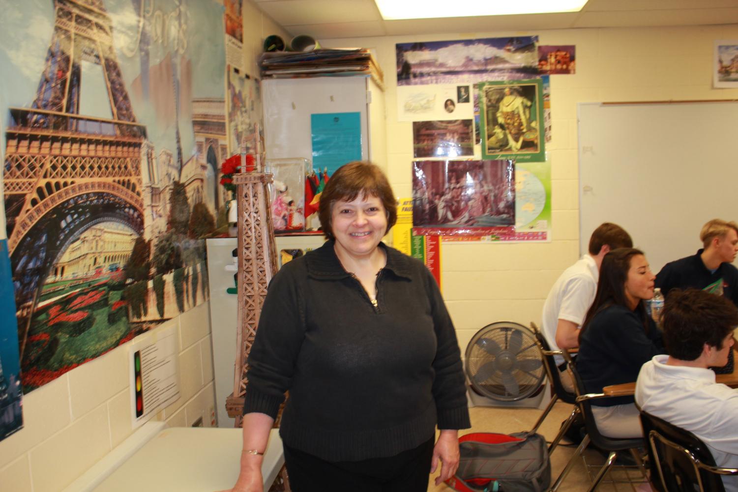 Bonjour: Long time Roncalli teacher Ms. Joe stands in front of her
