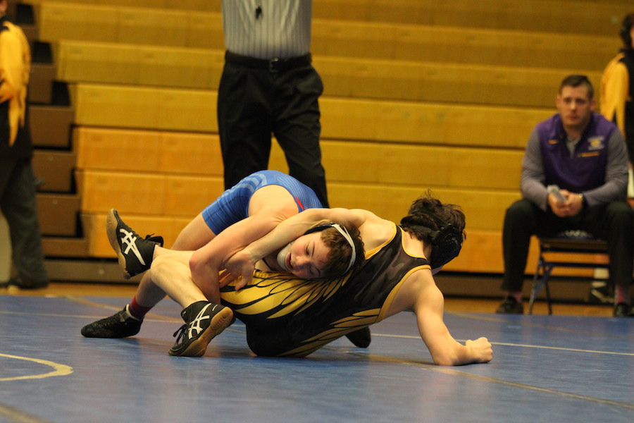 TAKING DOWN CONFERENCE: Sophomore Brayden Lowery takes down Guerin Catholic wrestler Jon Koscal to advance further in the Circle City Conference Meet. Lowery later ended up winning his conference.