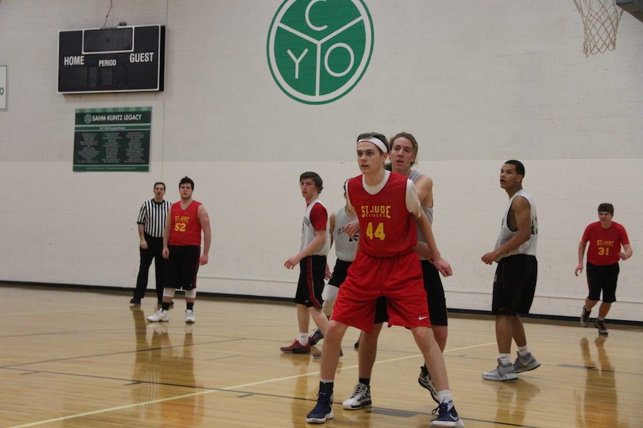 HEAD IN THE GAME: Senior Shane Sanneman guards his opponent at his team’s game against St. Christopher. His St. Jude team lost this game which ended their run at city.