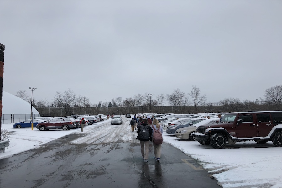 CAUTION: Coming out of school Monday morning resulted in many cars in the bubble parking lot covered in snow and ice. Many students had to dig out their car scrapers and brush off the snow and ice to be able to see on the drive home.