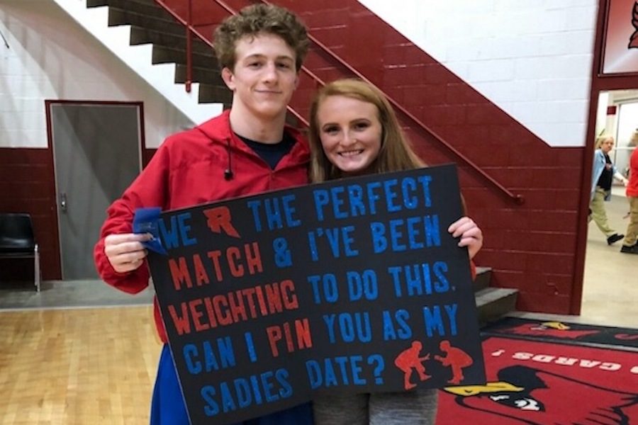 PERFECT MATCH: Junior Makayla Gilley asks sophomore Tyce Freije to the Sadie Hawkins dance. The photo was captured after Freije won sectionals, advancing to regionals.