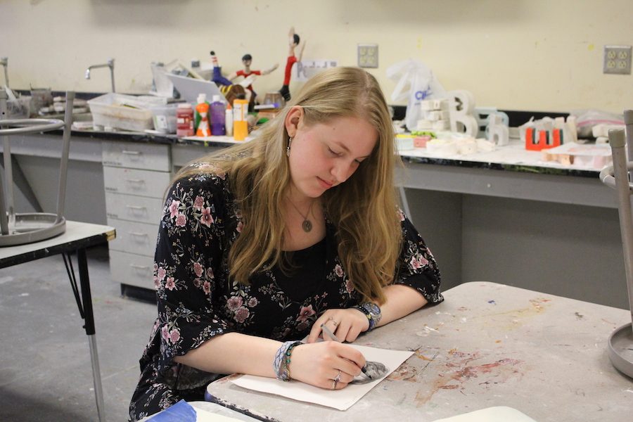Senior+Kathryn+Witsaman+sketches+a+picture+of+hair+for+her+AP+Studio+Art+class.+Witsaman+has+been+doing+art+since+she+was+in+grade+school%2C+but+started+to+take+it+much+more+seriously+in+high+school.+