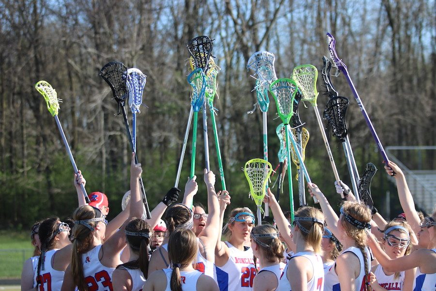 STICK+TOGETHER%3A+The+girls+lacrosse+team+celebrate+after+tying+Carmel+2-2.+This+was+the+first+time+the+Lady+Rebels+had+tied+another+team.+%0A%0A