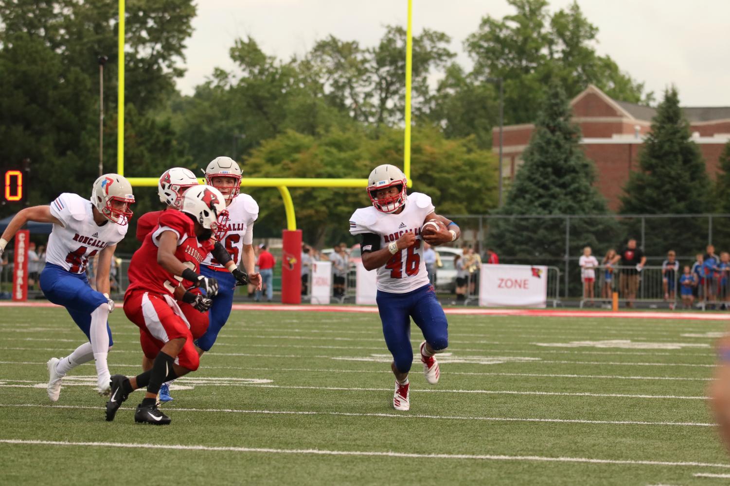 FINDING DAYLIGHT: Senior Elijah Mahan runs the ball against Southport. The Rebels fought hard, but were defeated by the Cardinals 36-28.