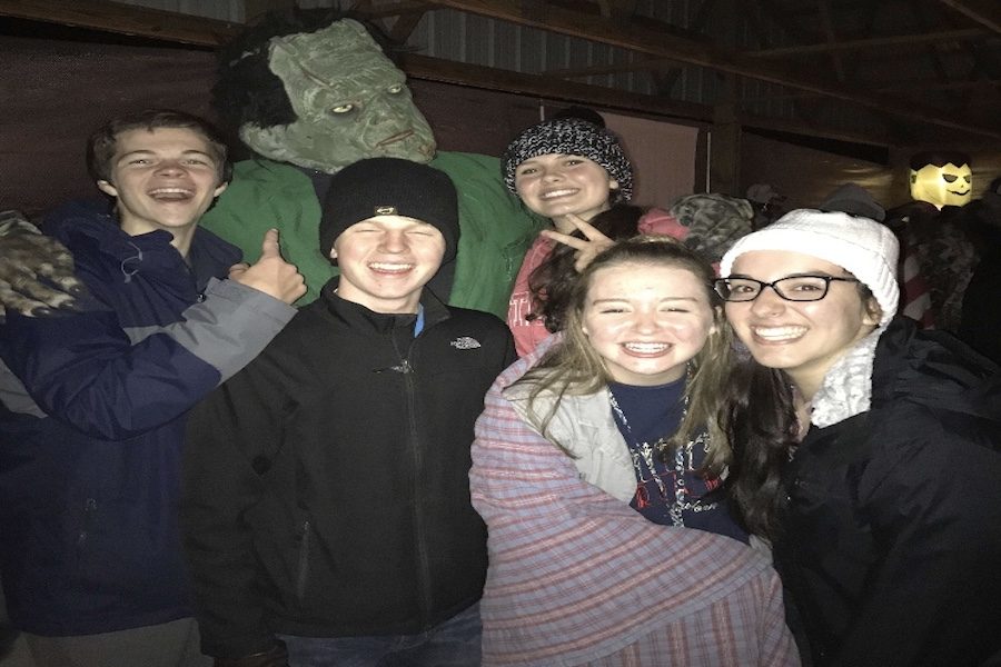 
FRANKEN-PHOTO: Seniors Mia Roberts and Allie Pena, along with juniors Lilly Secrest, Levi Ralston, and Trey Kocher pose with a costumed Frankenstein at Sweetwater Lake. Roberts did not enjoy the feeling of fear in the moment, but reported the rush as a rewarding experience. 
