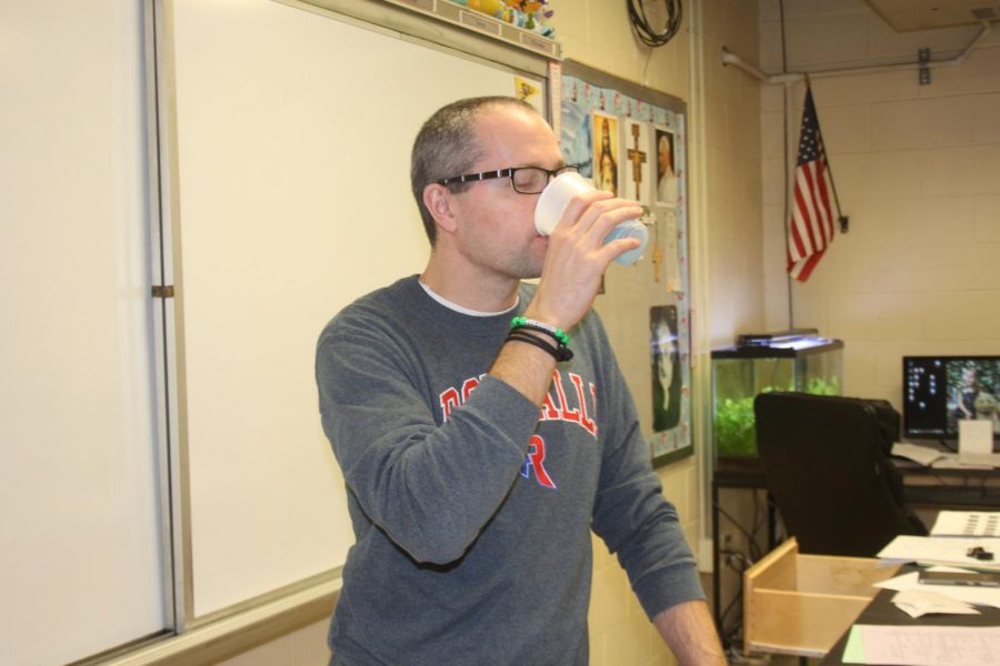 MMMM TASTY: Chemistry teacher Ben North drinks the remaining gulps of original Windex spray cleaner. North drinks approximately two gallons of the savory blue raspberry cleaner each week.
