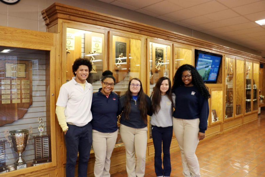 WE CARE: Seniors Elijah Mahan, Sarah Hayden, Chelsea Nguyen, and Nellie Nnatubuego and junior Angie Snow along with several other students are part of Roncalli’s We CARE initiative. This group began with the goal of making Roncalli a more welcoming and comfortable environment for students of minority background.

