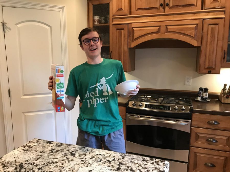 CEREAL SADNESS: Sophomore Ronan Euzen is overcome by utter depression as he prepares to eat cereal for the millionth time. Fortunately for him, quarantine presents him with the time to undertake the task of learning how to cook.