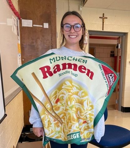 Promoting the canned food drive, junior Anna Povinelli encourages students to participate in this years drive.