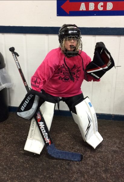 A GOAL TO WIN: Geared up and ready to take on the ice, Alexandra Gorski poses for a picture before her game. She is the goalie for her Indy Fusion team. 