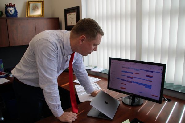 Working on the calendar, Principal Kevin Banich is perfecting the school year schedule.
