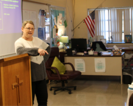 SEEING GOD EVERY DAY: Teacher Mrs. Julie Watson is seen starting off her class with “God sightings” - instances where students see God in their everyday lives.