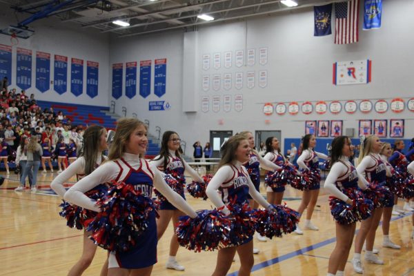 Freshman cheerleaders help keep the spirit at the first pep rally of the new school year