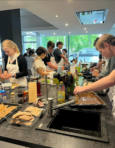 SAVORING SKILLS: Embracing the art of culinary creation, Roncalli students take a cooking class at Germany while exploring flavors, mastering techniques, and gaining confidence in the kitchen.
Photo from Instagram, @germanatroncalli.
