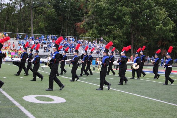 The Roncalli band marches out at the start of the game to play the national anthem at the second home game of the season. Later, they returned to play their ABBA set at halftime. 
