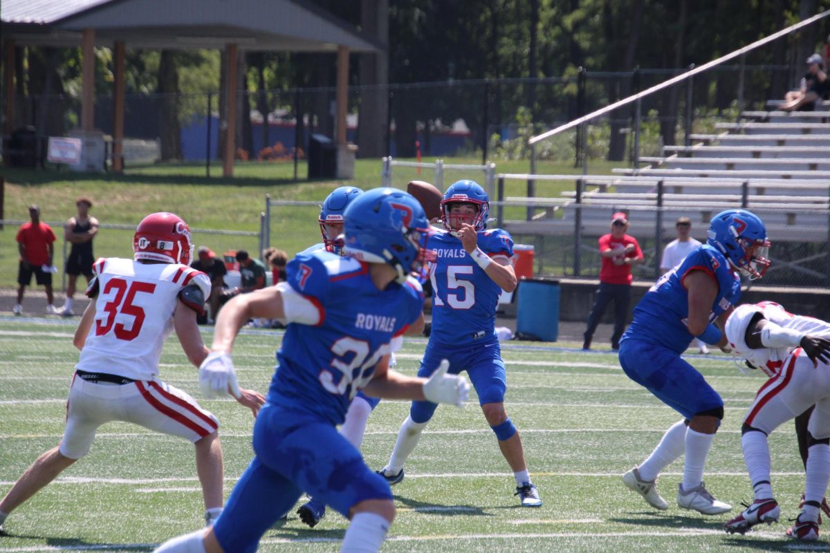 Quarterback Kallen Stahley throws a dart to Turner Douglas in a 42-0 win over Southport in their first game of the season