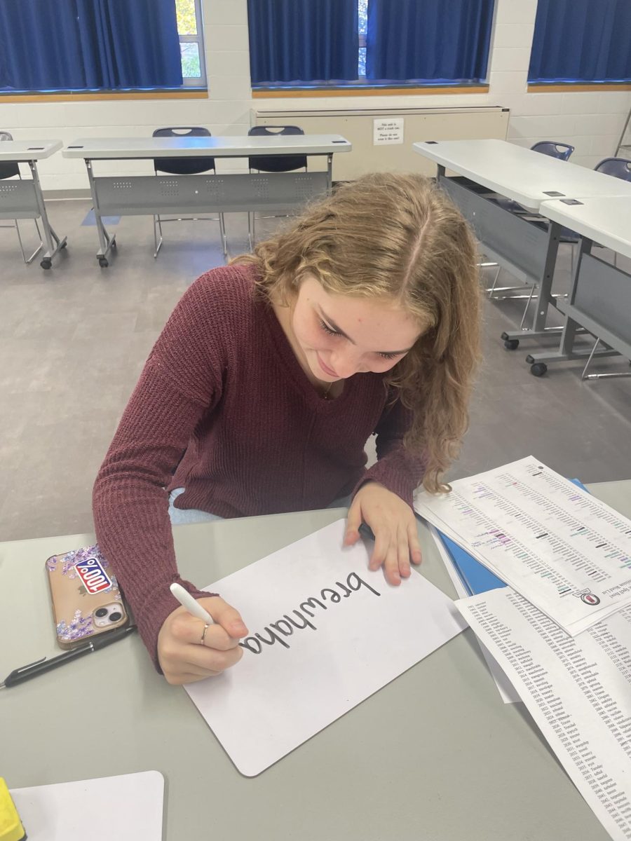 WORD WARRIOR: Making her debut on the Roncalli High School Spell Bowl team, freshman Scout Marien has been an experienced speller since elementary school. Scout is working hard for the Area Competition, where she meticulously crosses off words used from the competition.
