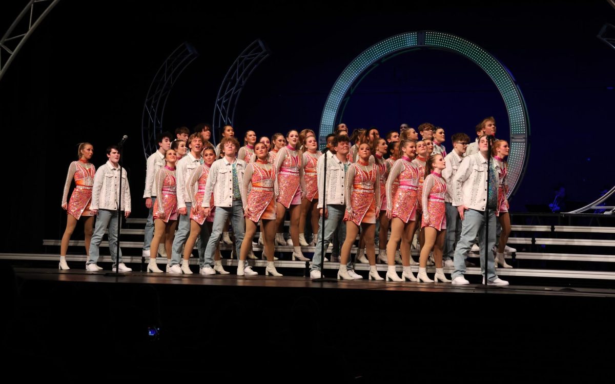 Royal Rhapsody Show Choir in their final costume change, performing their last song.

