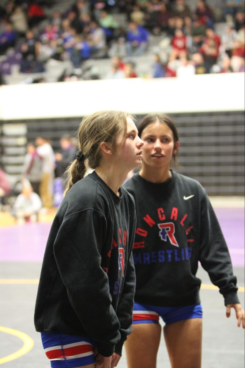 Seniors Claire May and Olivia Lemus practice together at Regionals. Both wrestlers qualified for the state tournament placing 3rd, while May entered the state tournament with a 36-1 record. 