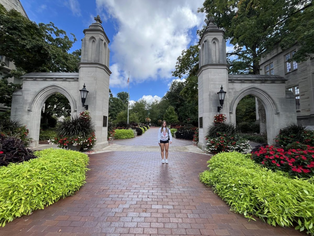 On a visit to one of her top choices, senior Regan Schoettle stands between IU Bloomington's infamous Sample Gates.